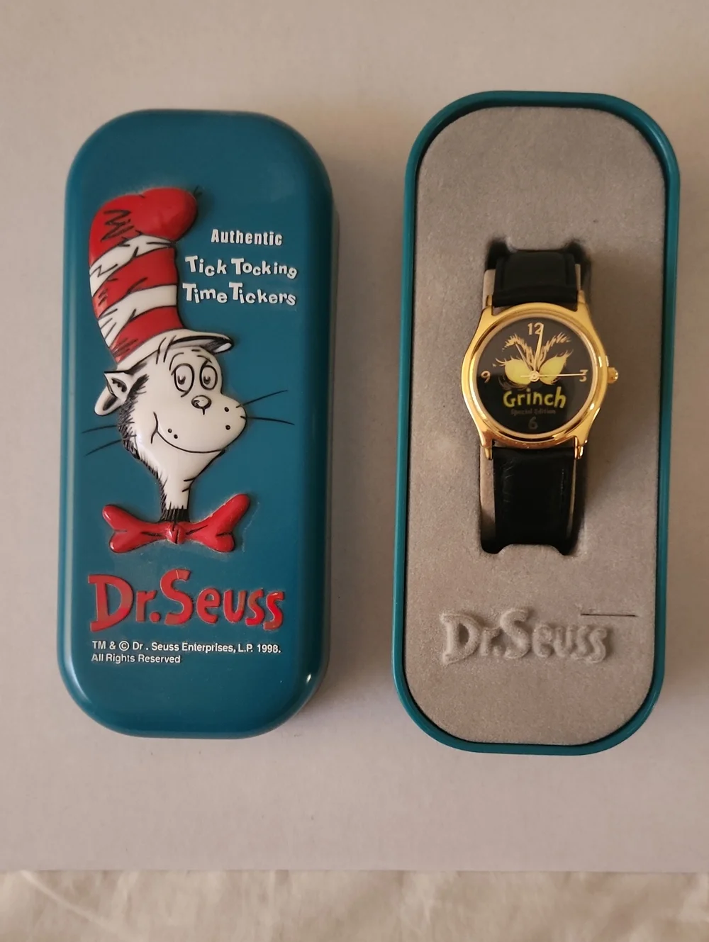 Dr. Seuss Teal Tin with Gold-Tone Grinch Watch and Black Strap